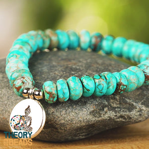 Natural turquoise stone bracelet with buddha charm. Silver and blue bracelet 